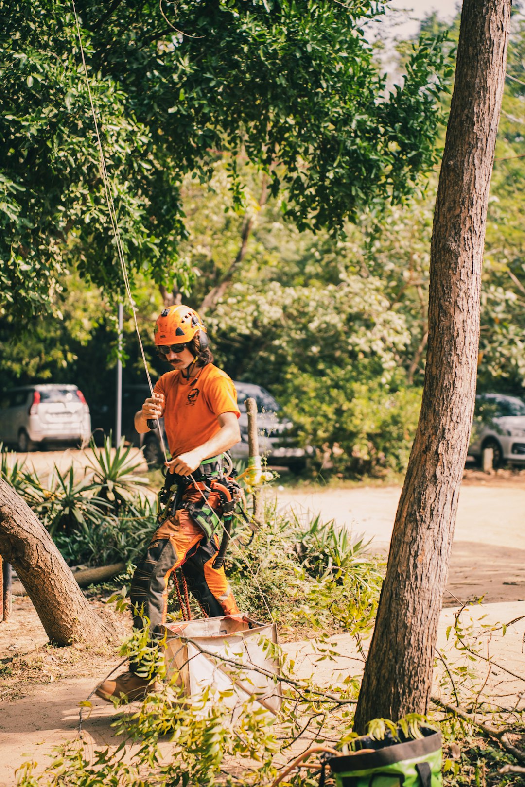 a-man-in-an-orange-shirt-is-on-a-bicycle-xc3zwyak7he